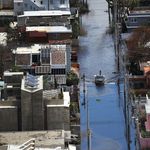 : A flooded street is seen as people deal with the aftermath of Hurricane Maria on September 25, 2017 in San Juan Puerto Rico.